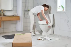 Rehausseur de toilettes Etac My-Loo - fixe, avec couvercle , ep. 6 cm, fixé sur toilettes